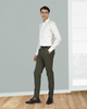 Model wearing custom Genoa Chino pants for men by Luxire in olive green hand in pocket