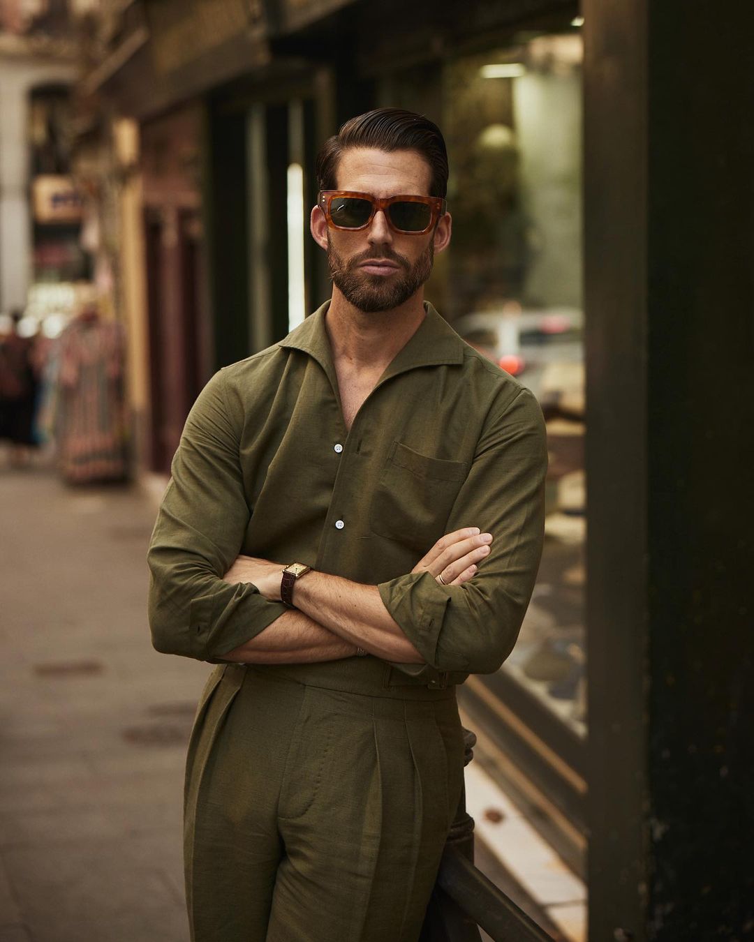 Male model in custom linen Gurkha pants for men by Luxire in olive arms crossed