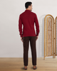 Back of model wearing the custom oxford polo shirt for men by Luxire in maroon